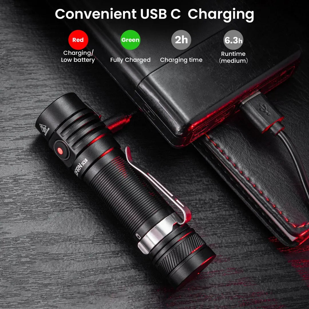 USB-C rechargeable tactical flashlight with red indicator, charging via power bank on dark wood
