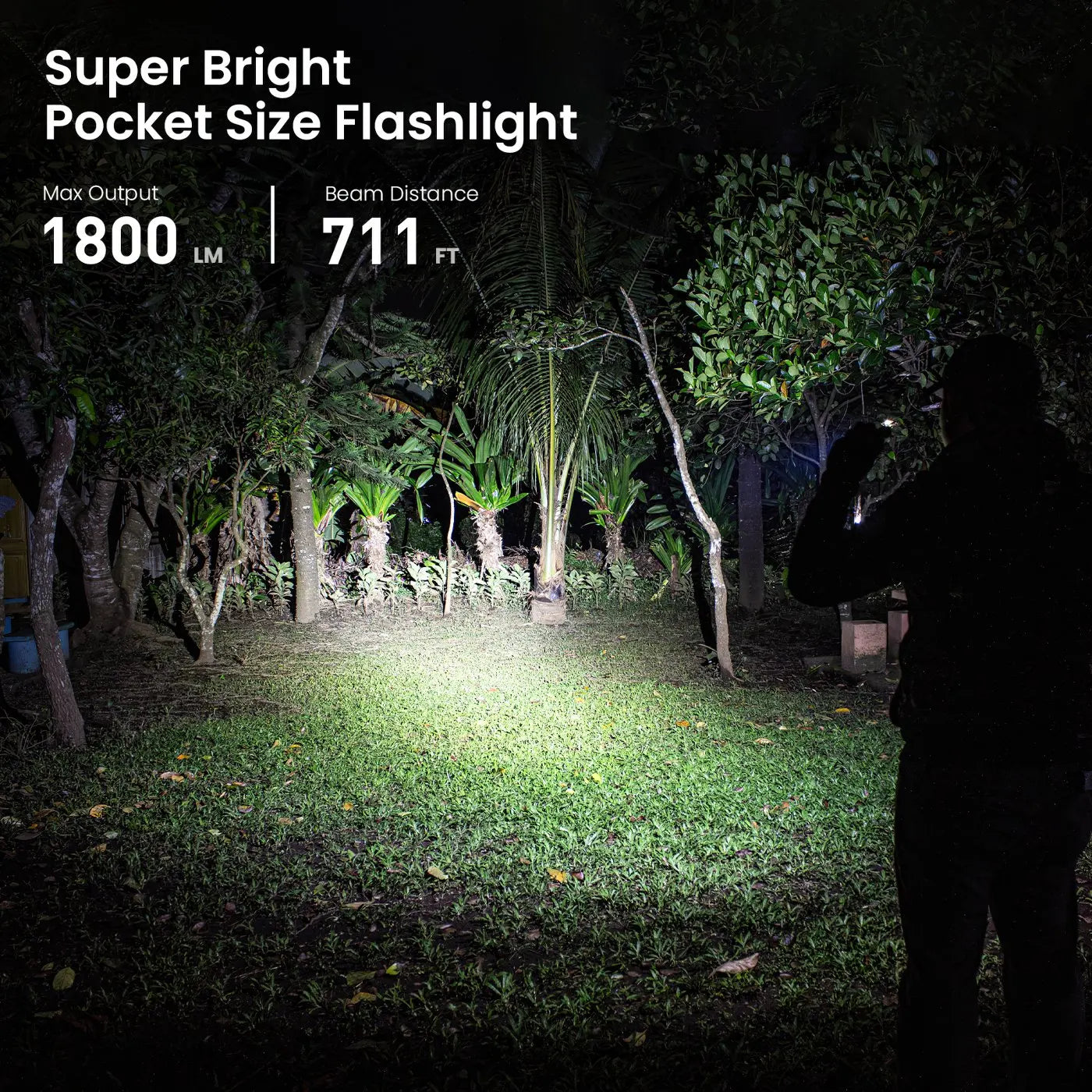 Super bright pocket flashlight illuminating night yard, 1800 lumens, 711 ft beam for outdoor safety